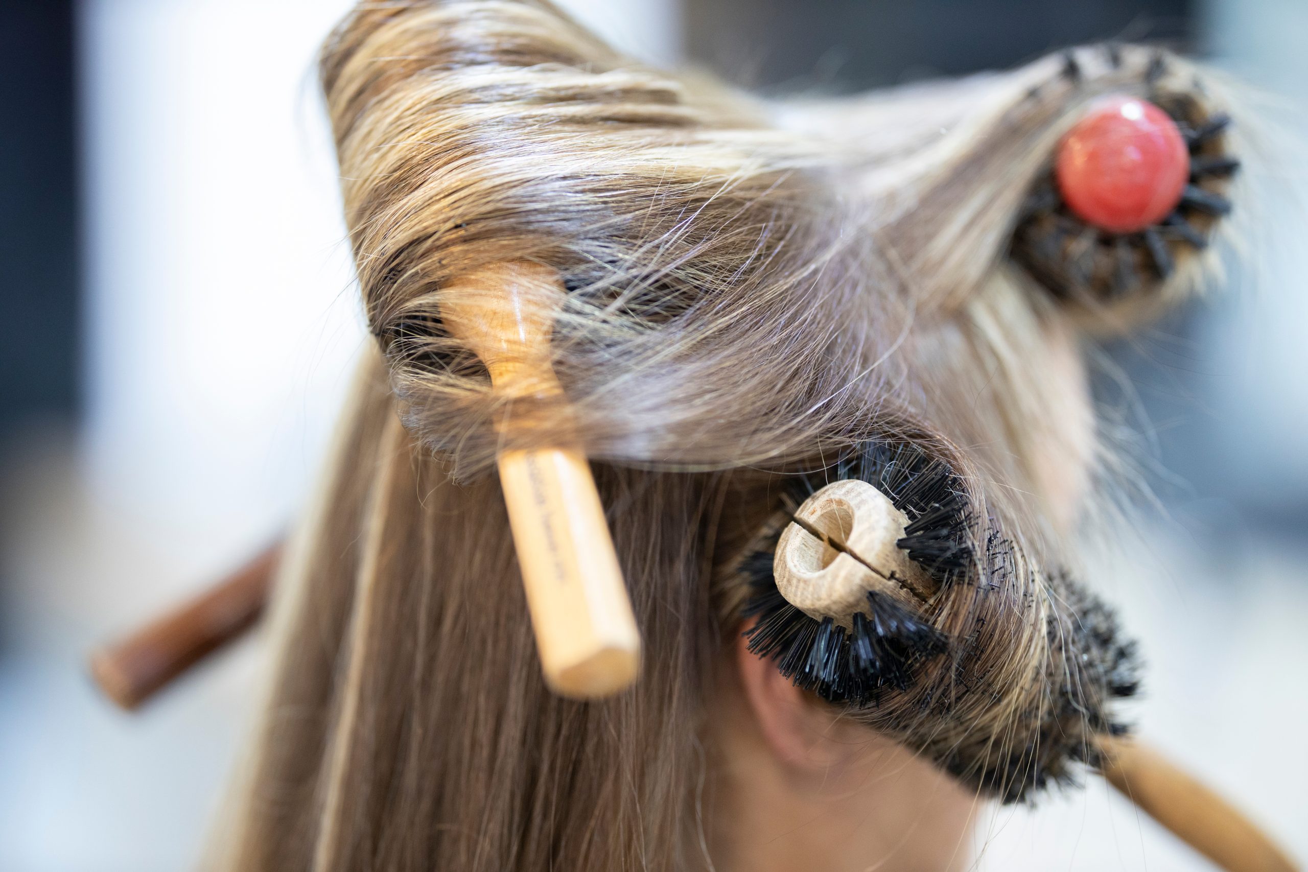 woman-with-hair-styling-brushes-extreme-close-up-2026-03-26-04-28-29-utc